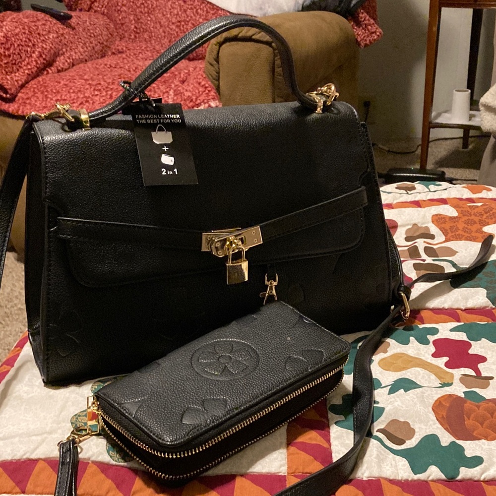 Elegant Black Leather Handbag with matching wallet.